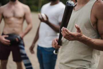 group of young multiethnic male baseball players on court