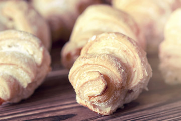 Homemade baking with fresh apricot filling. Closeup. Selective focus.