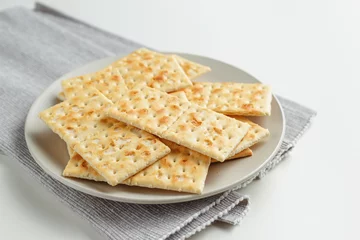 Rolgordijnen Snack plate of crackers closeup on the table © ansyvan