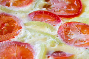 Fresh cooked vegetarian omelette from eggs, tomatos and bell pepper. Selective focus, closeup