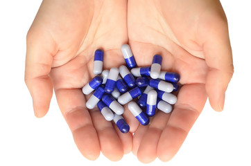 Blue pills in the palms