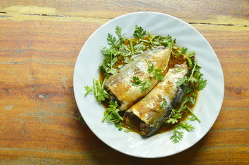 boiled mackerel fish sauce soup topping parsley on plate