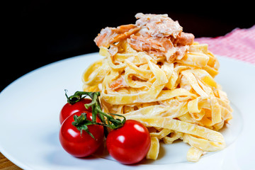 tasty pasta with salmon on a the table