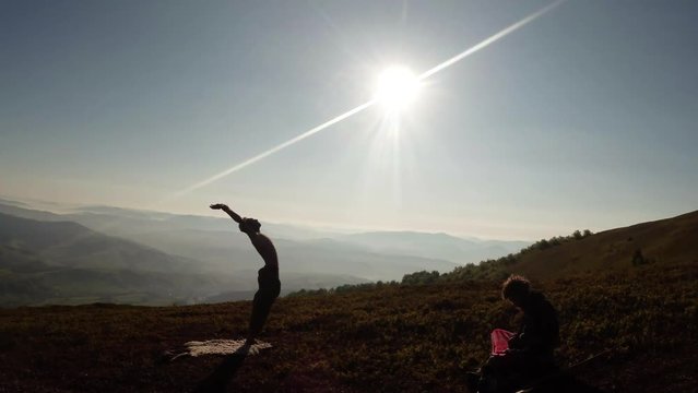 the Morning Sun Touches the Yogi Who Gives Him a Bow, Next to Another Yogi Doing Something in the Lotus Position Tractile Crescent Moon