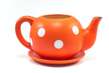 Ceramic flower pot in form of teapot isolated on white