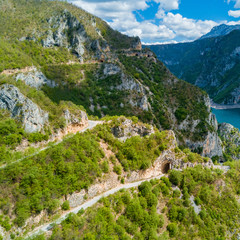 Fototapeta na wymiar Part of the mountain with transport highways and tunnels near the sea