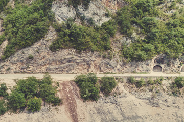 Empty highway and tunnel in the mountains. Toned