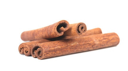 Fragrant cinnamon sticks isolated on white background