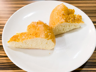 Bread on a white plate in a cafe