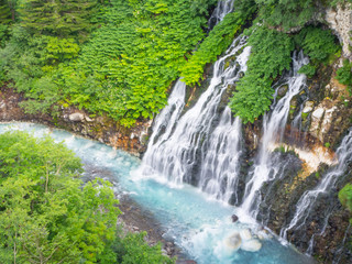 Fototapeta na wymiar Natural landscape of Shirohige waterfall in summer at Biei Hokkaido, Japan.