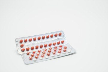 Contraceptive pills on white background