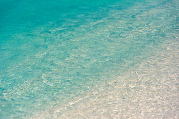 Azure water of the beach Playa Paradise of the island of Cayo Largo, Cuba. Сlose-up.