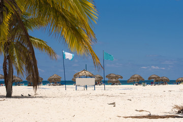 Fototapeta na wymiar Banner on the beach Playa Sirena of the island of Cayo Largo, Cuba. Copy space for text.
