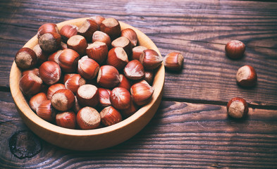 Nut hazelnuts in a wooden plate