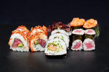 Sushi on black background. Perfect for creating sushi restaurant menu. Part of series.