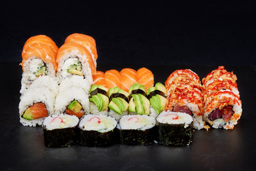 Sushi on black background. Perfect for creating sushi restaurant menu. Part of series.