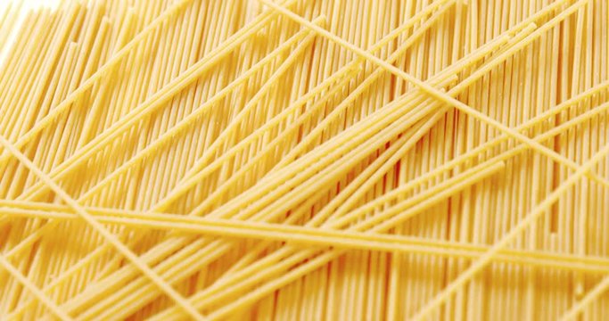 Raw spaghetti on white background