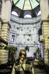 Girl walking on old streets of Bucharest. Romania. Europe. Traveler. City Brake