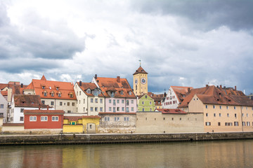 Fototapeta na wymiar Old town of Regensburg at the river Danube on a cloudy day, Bavaria, Germany