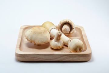 Mushrooms in a wooden tray