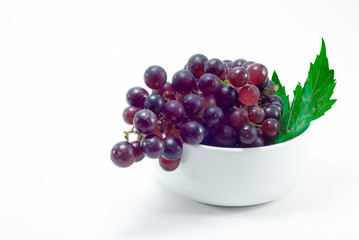 Grapes in a white cup