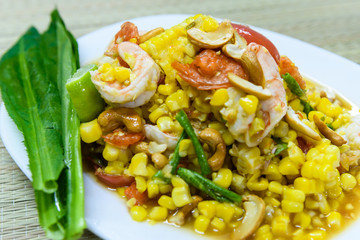 Pound corn with fresh shrimp