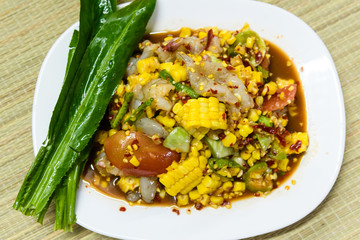 Pound corn with fresh shrimp