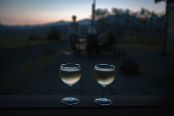 two glasses of tasty white wine at sunset