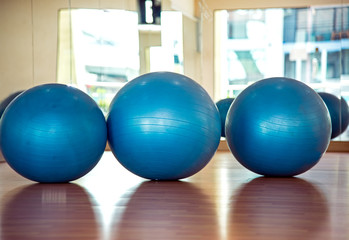 Naklejka premium Yoga ball and map in fitness room. Healthy Concept.