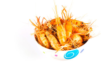 Heap of barbecue shrimps on white bowl