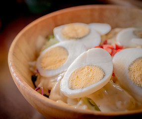 Delicious salad with egg and herbs.