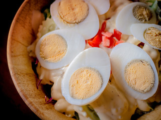 Delicious salad with egg and herbs, healthy food.