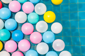 Plastic balls in swimming pool.