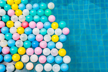 Plastic balls in swimming pool.