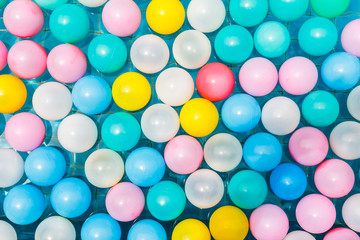 Plastic balls in swimming pool.