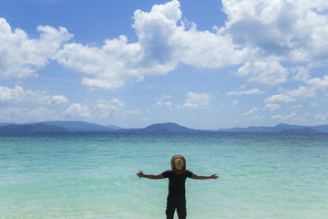 Andaman Sea, emerald water, blue sky, beautiful clouds and mountains.