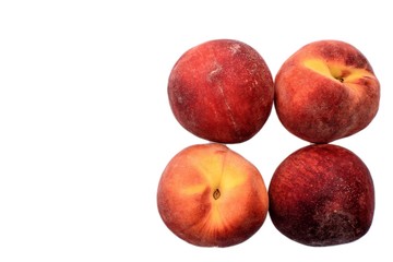 A few ripe peaches isolated on a white background