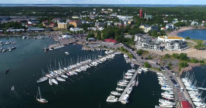 Hanko, Cinema 4k aerial view around tehtaanniemi, in ita-satama, full of boats and people, on Hango regatta day, in Uusimaa, Finland