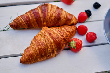 Delicious croissant with strawberry.