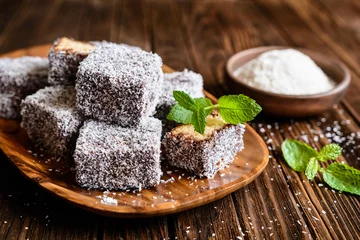 Fotobehang Lamington cakes with chocolate and coconut coating © noirchocolate