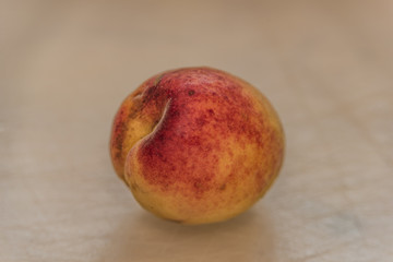 Apricot on white gray table in summer day
