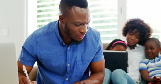 Worried man calculating bills 