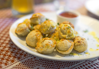 Traditional Russian pelmeni with cheese and tomato sauce.