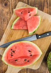 Portion of Fresh Watermelon on wooden background (selective focus).