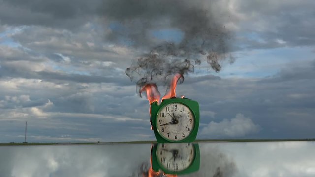 Time and fire concept. Burn old retro clock on mirror in space. Time fire, Clock fire