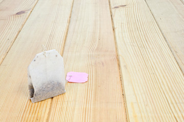 Fototapeta na wymiar Tea bag on wooden table