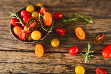 Multicolored tomatoes on a bowl