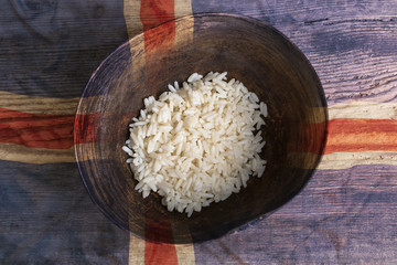Poverty concept, bowl of rice with Iceland flag