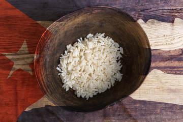 Poverty concept, bowl of rice with Cuba flag