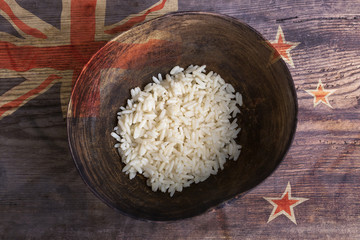 Poverty concept, bowl of rice with New Zealand flag